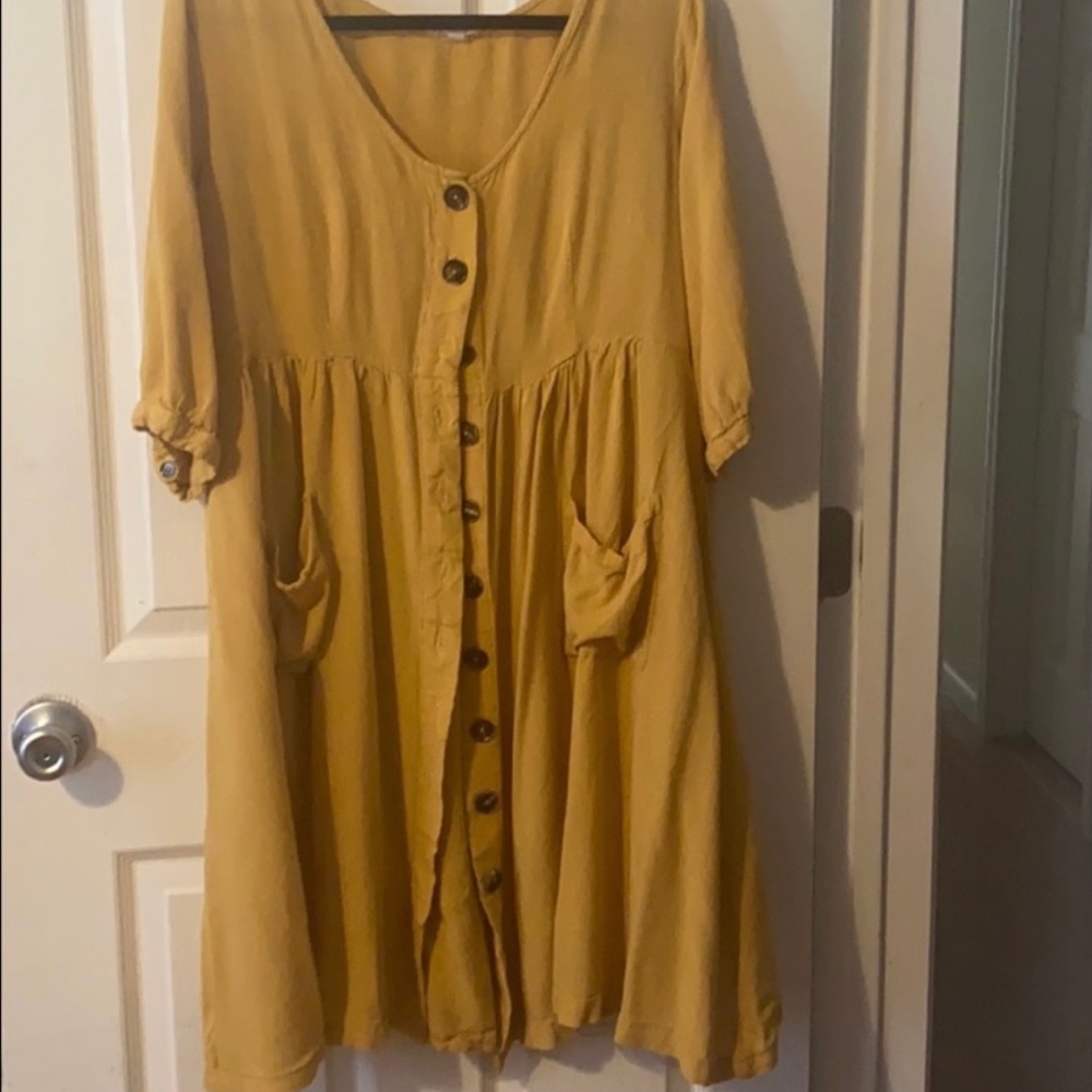 Oddy button up dress with pockets.